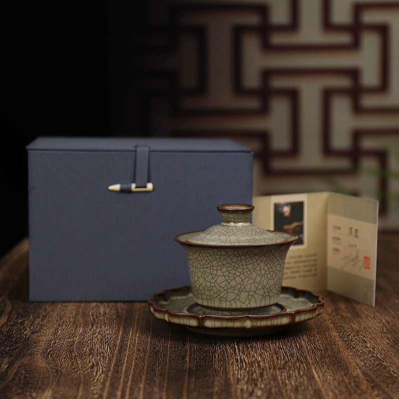 Artisan Longquan celadon GE style three-piece tea bowl set, handcrafted with traditional techniques for collectors.