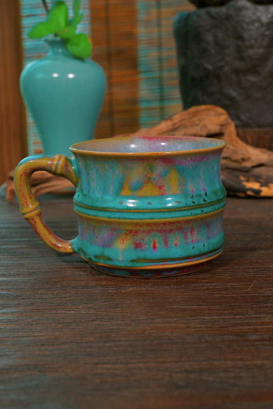Li Panlong Jun kiln peacock turquoise mug featuring sculpted bamboo stalk handle and crimson glaze flecks