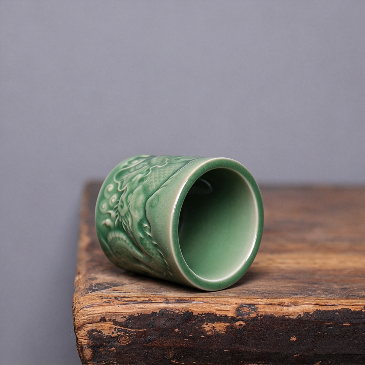 Handmade Longquan Celadon master cup displaying jade-like glaze finish and dragon carving