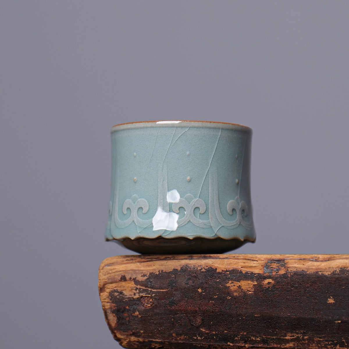 Handmade Longquan Celadon master cup displaying jade-like matte glaze texture and micro crackle
