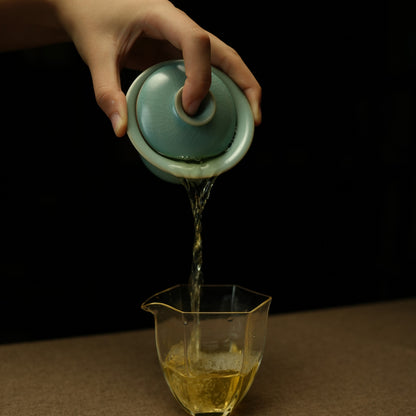 Handmade 110ml Ru Ware lidded tea bowl displaying jade-like matte texture and cicada wing crackle   