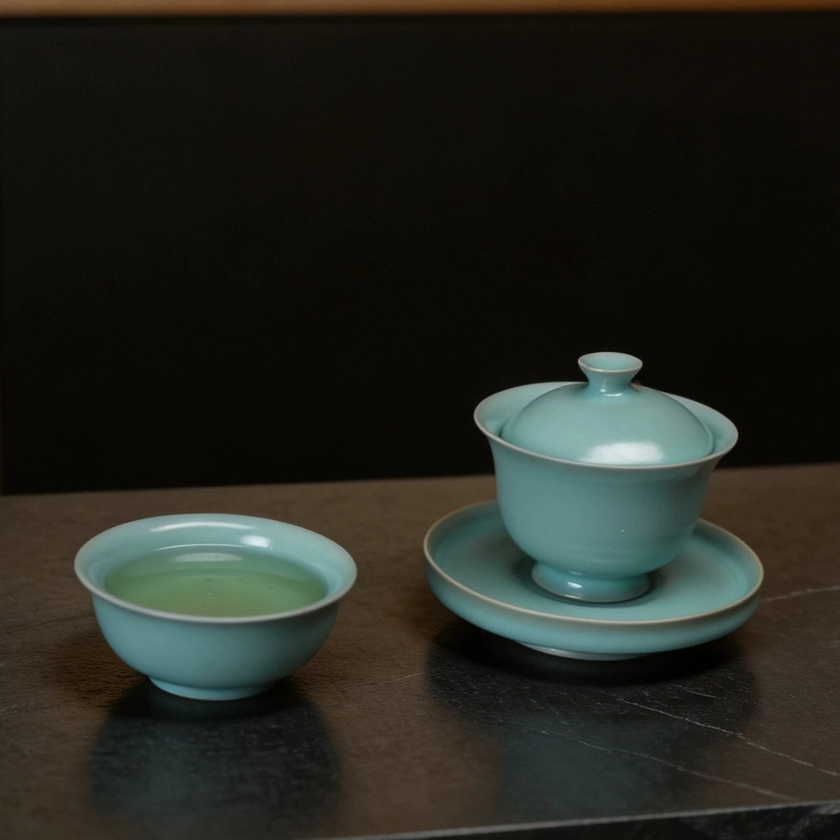 Handmade 120ml Ru Ware lidded tea bowl displaying jade-like texture and cicada wing crackle   