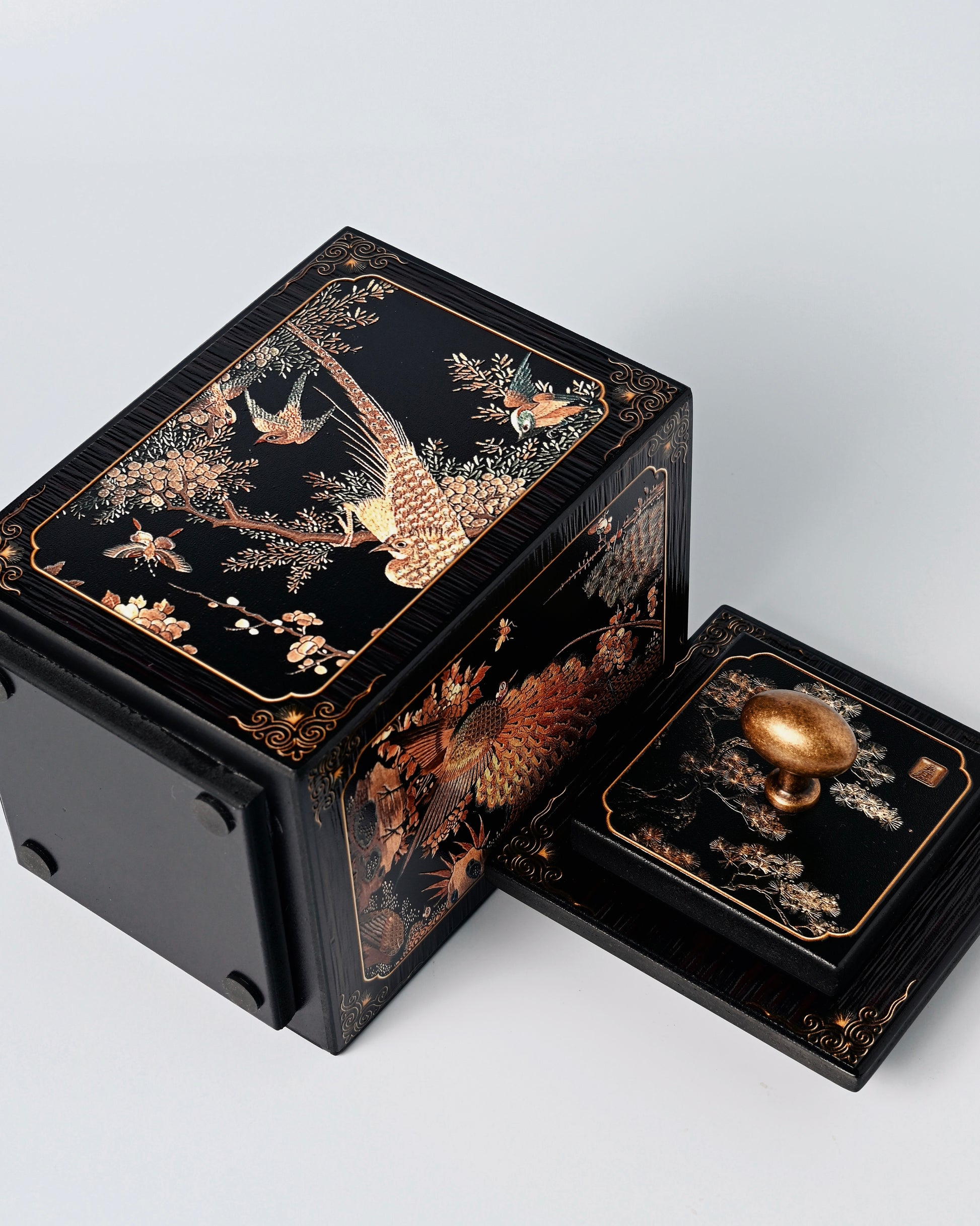 Bamboo charcoal tea storage container with 3D relief carving featuring traditional phoenix and birds motif