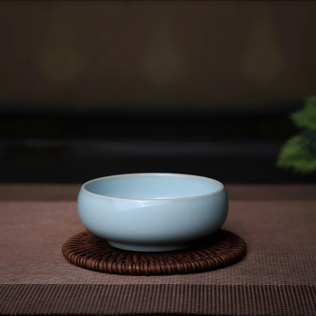 Handcrafted Ru Ware sky blue Pu'er master teacup with natural ice crackle glaze on rattan coaster