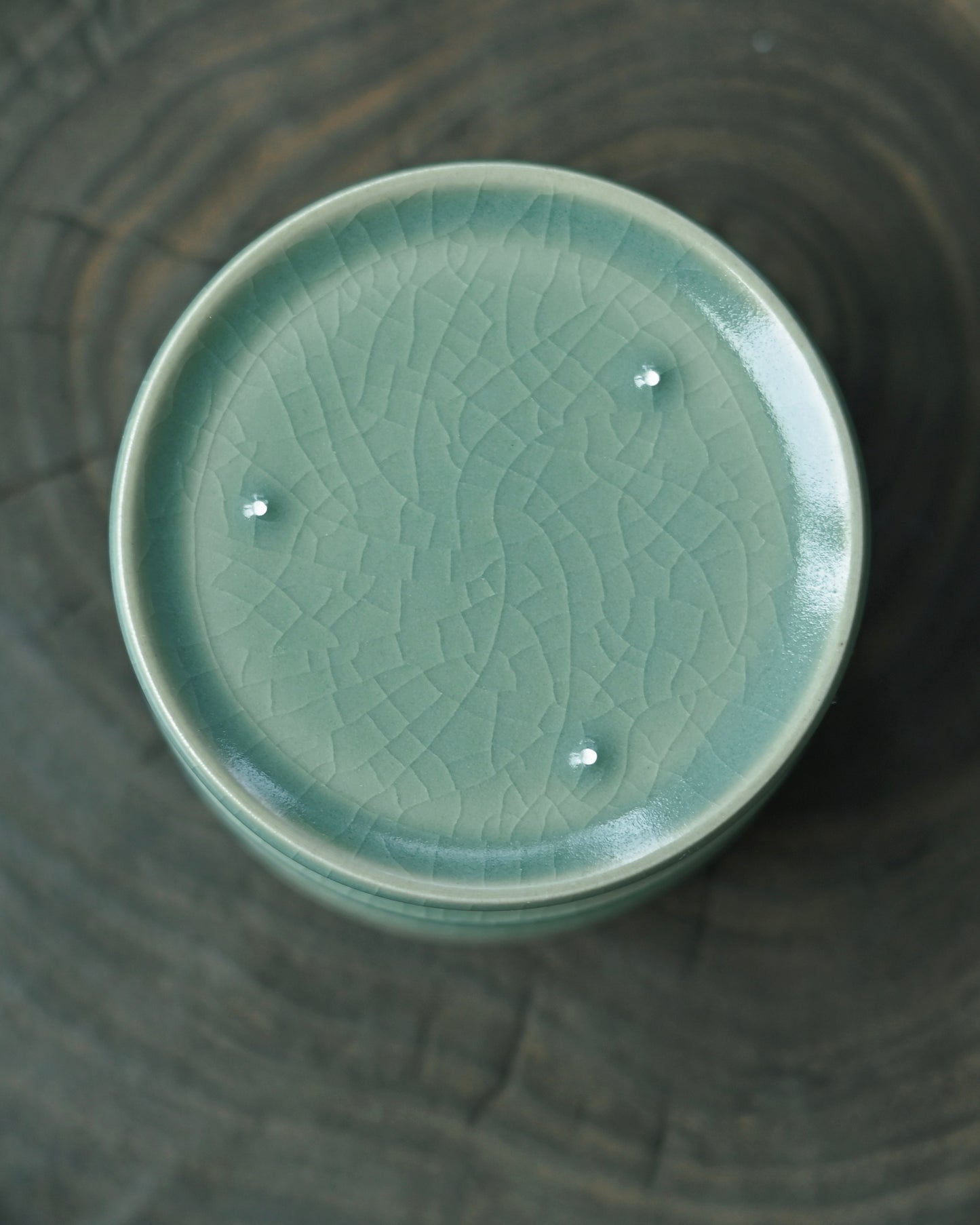 Blue-green Ru porcelain cup with jadeite-like transparency, showcasing rare Song Dynasty celadon glaze coloration