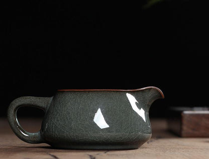 Tea server in iron-gray Longquan celadon, combining high-gloss glaze with classic crackle art.