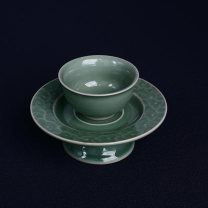 Chinese celadon teacup with refief carved clouds pattern
