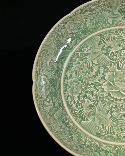 Sharp carved nine phoenixes ceramic plate from northern Yaozhou kiln tradition emphasizing decoration