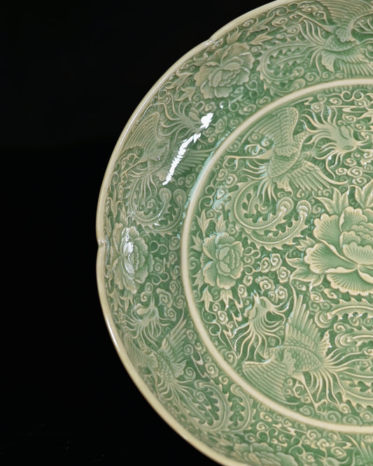Sharp carved nine phoenixes ceramic plate from northern Yaozhou kiln tradition emphasizing decoration