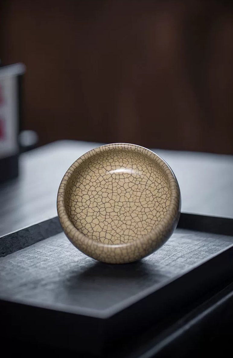 Traditional craftsmanship: smooth foot ring and aged appearance of a Ge Kiln tea cup