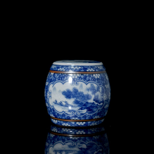 Antique-style blue-and-white porcelain lid holder shaped as ancient Chinese war drum with underglaze landscape painting