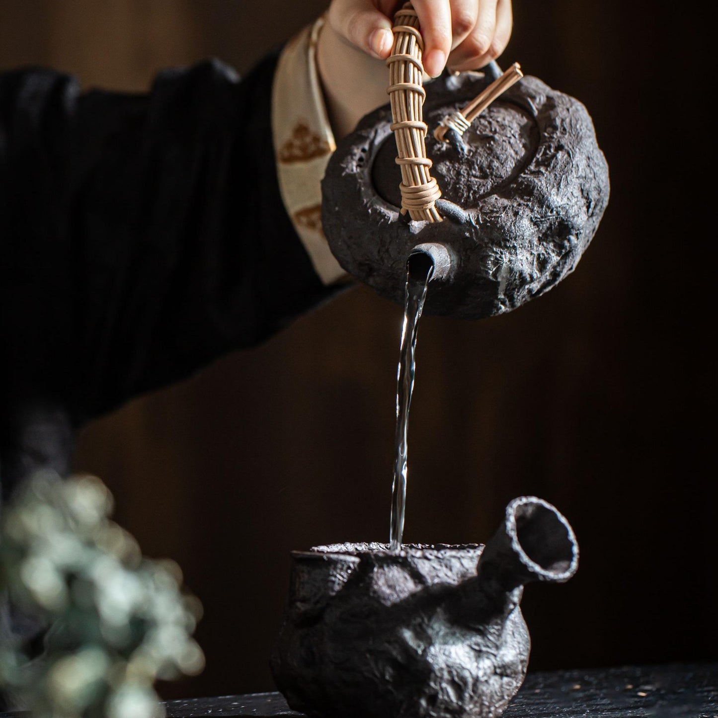 Traditional charcoal heating method creating meditative tea preparation experience