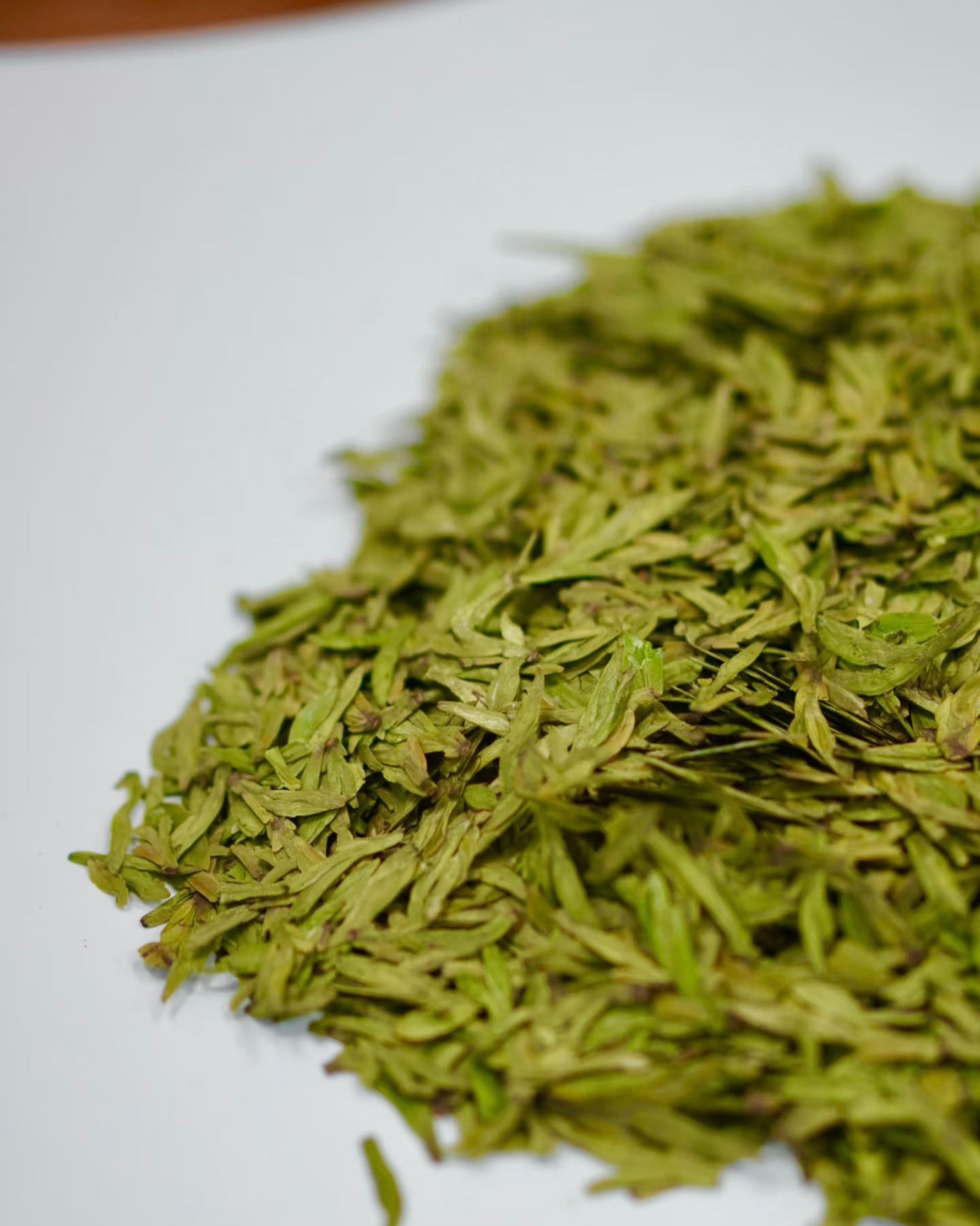 Traditional hand-firing process of Longjing tea in iron wok by skilled tea master