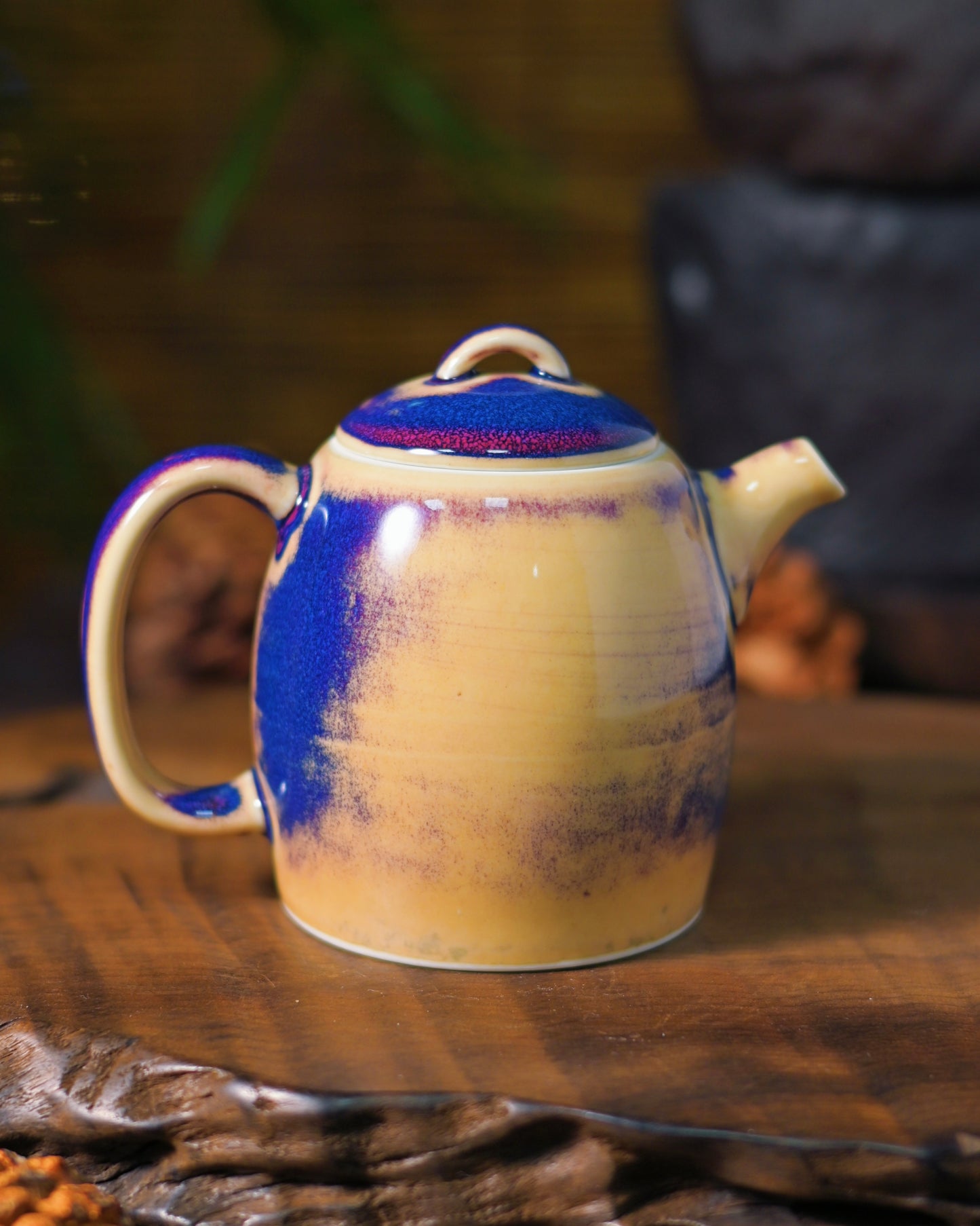 Close-up of glossy glaze texture on Jun porcelain teapot surface