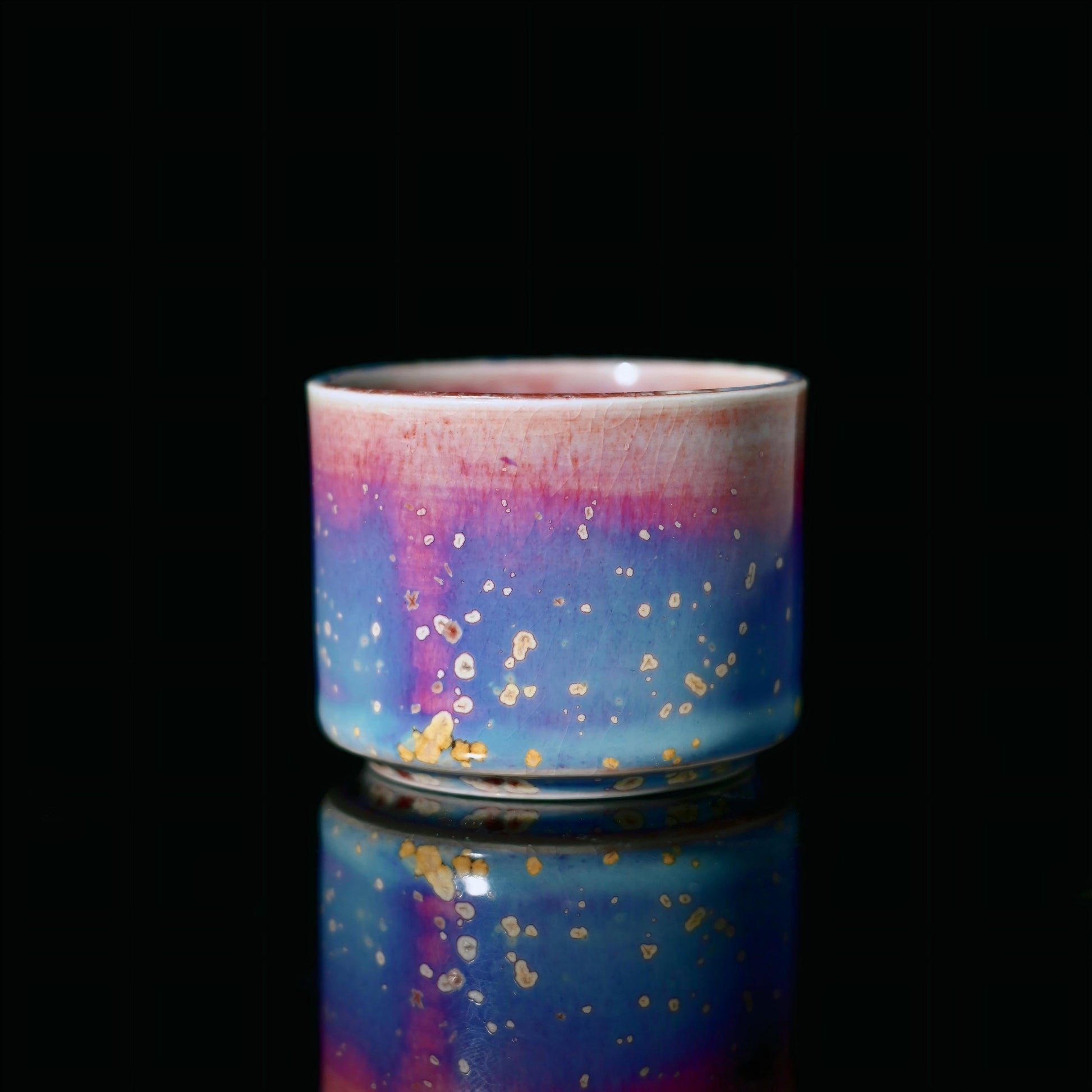 Jun ware thumb-ring cup featuring ergonomic design for comfortable finger-held tea drinking