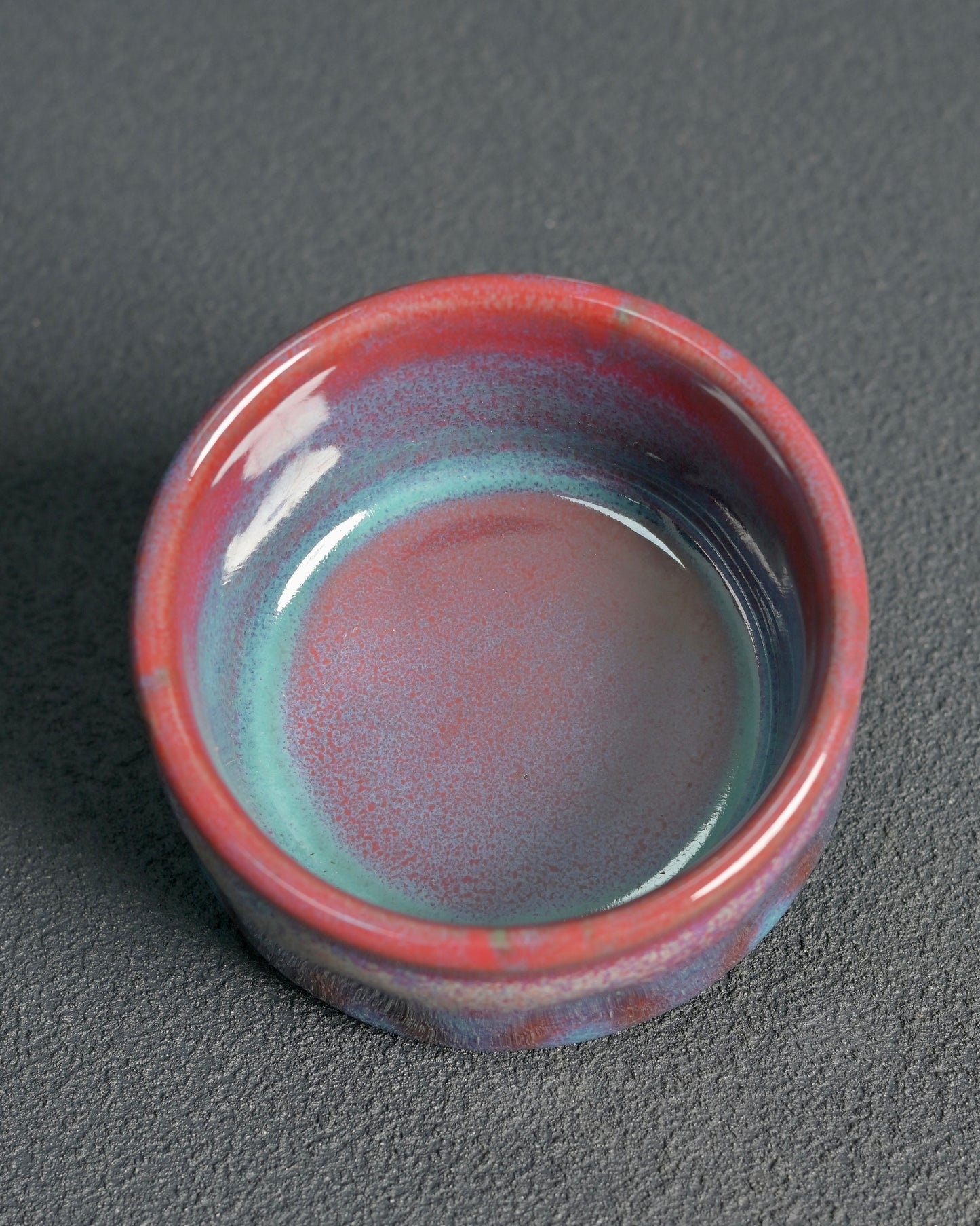 Chinese Jun ware handcrafted in Shenhou with glaze transformed, features flowing lavender/oxblood colors, wide mouth design, and 180ml capacity for oolong and dark tea ceremonies.