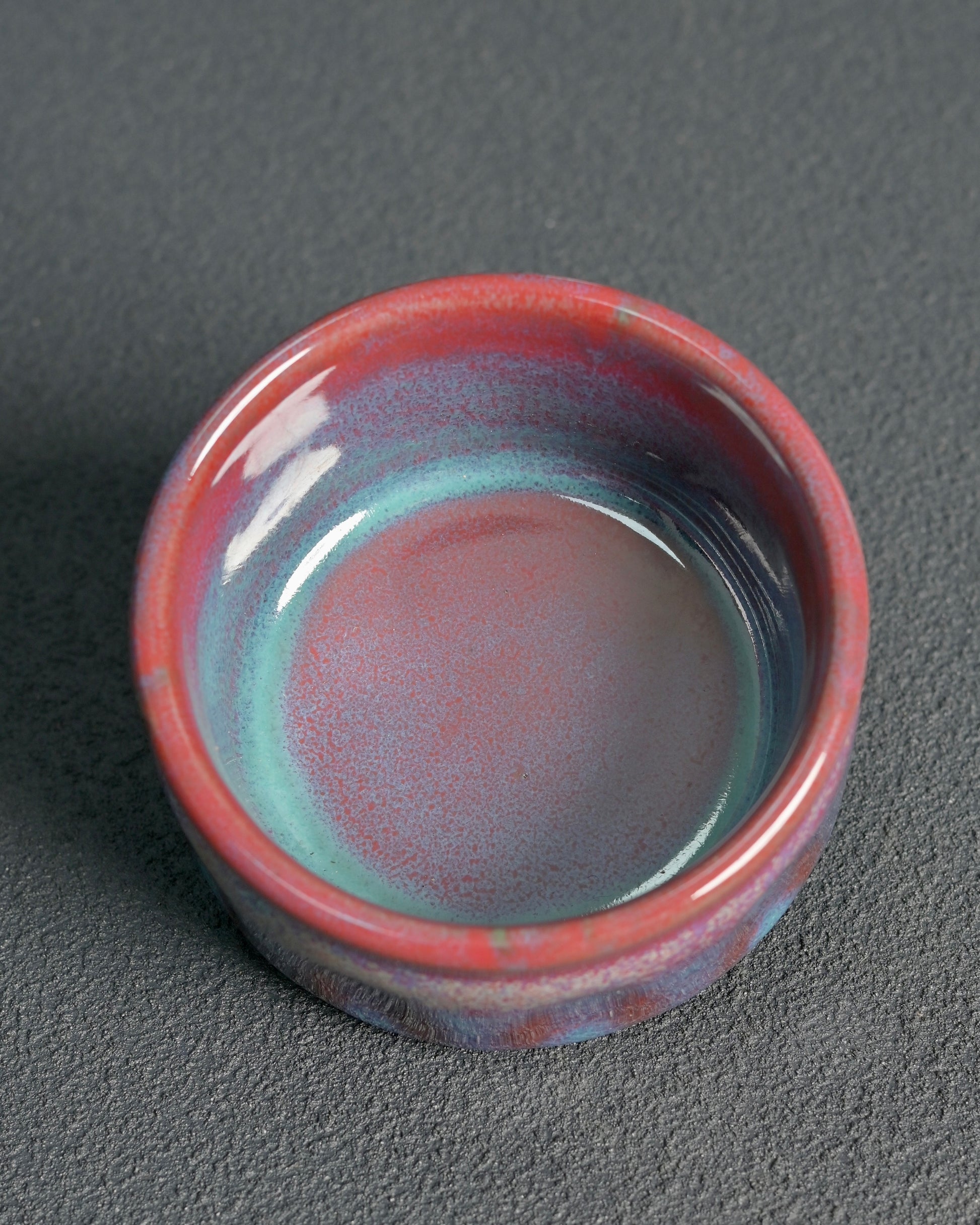 Chinese Jun ware handcrafted in Shenhou with glaze transformed, features flowing lavender/oxblood colors, wide mouth design, and 180ml capacity for oolong and dark tea ceremonies.