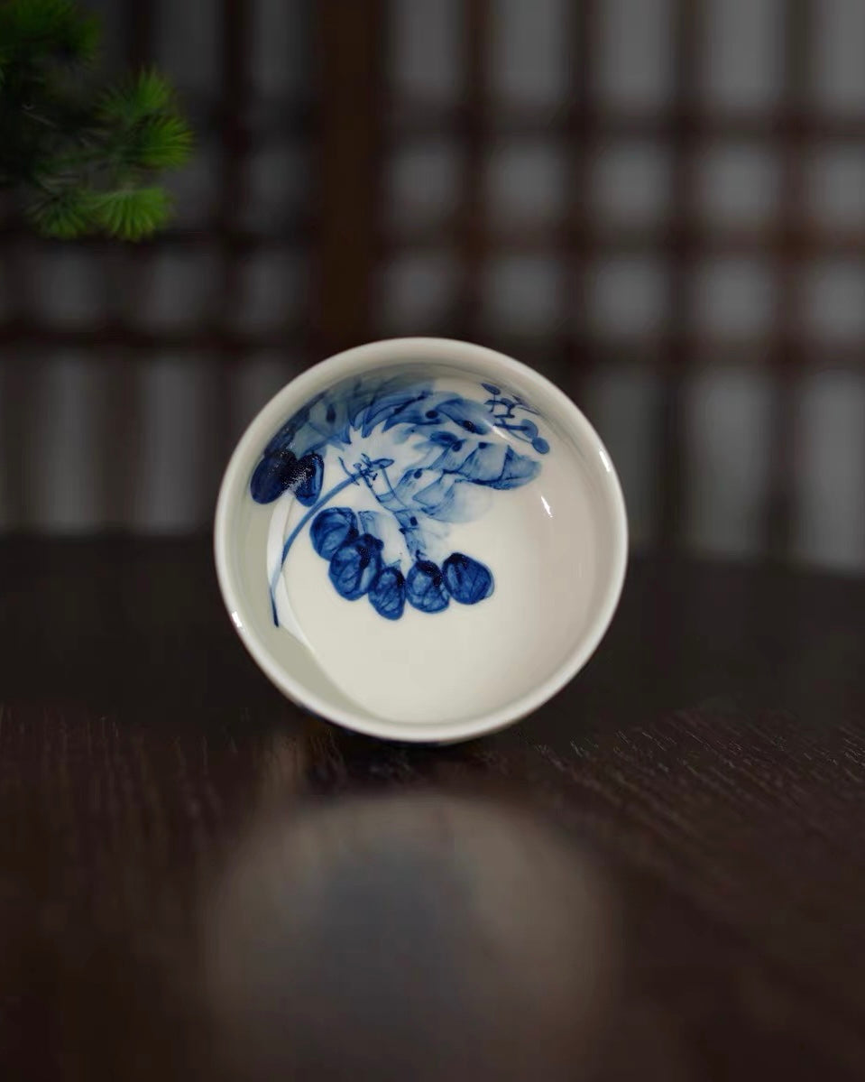 Porcelain rim detail showing clear transparent glaze over hand-painted floral brushwork