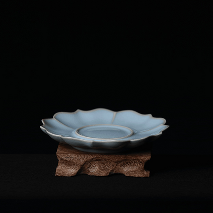 Handcrafted Ru porcelain teacup saucer with eight-lobed sunflower rim and signature sky-after-rain glaze coloration