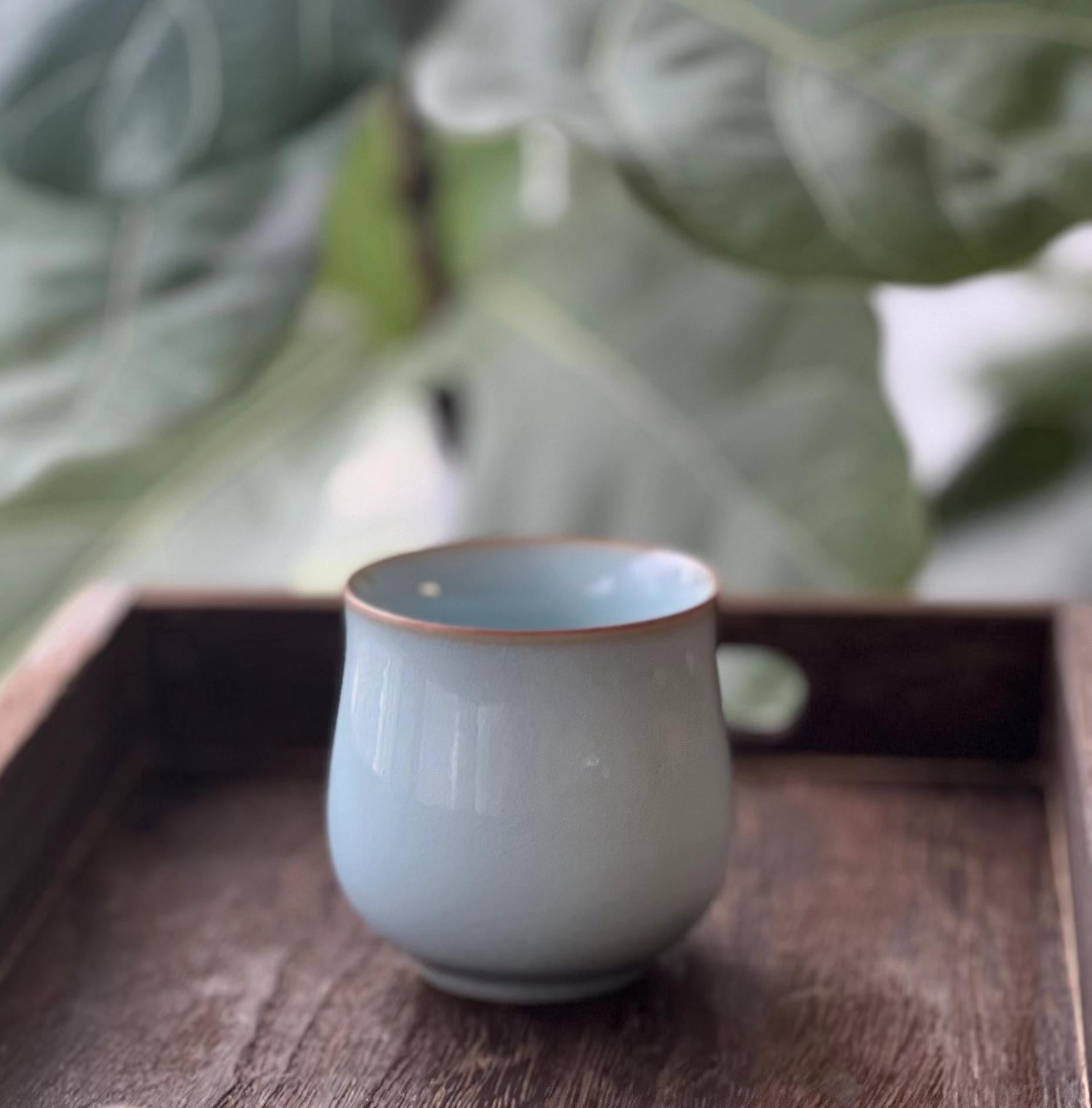 Zen tea ceremony ware featuring Ru ware's subtle crackle patterns for mindful drinking practice
