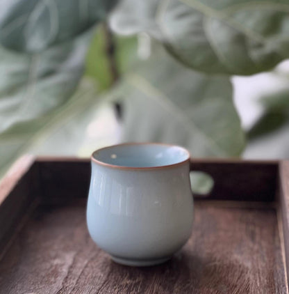 Zen tea ceremony ware featuring Ru ware's subtle crackle patterns for mindful drinking practice