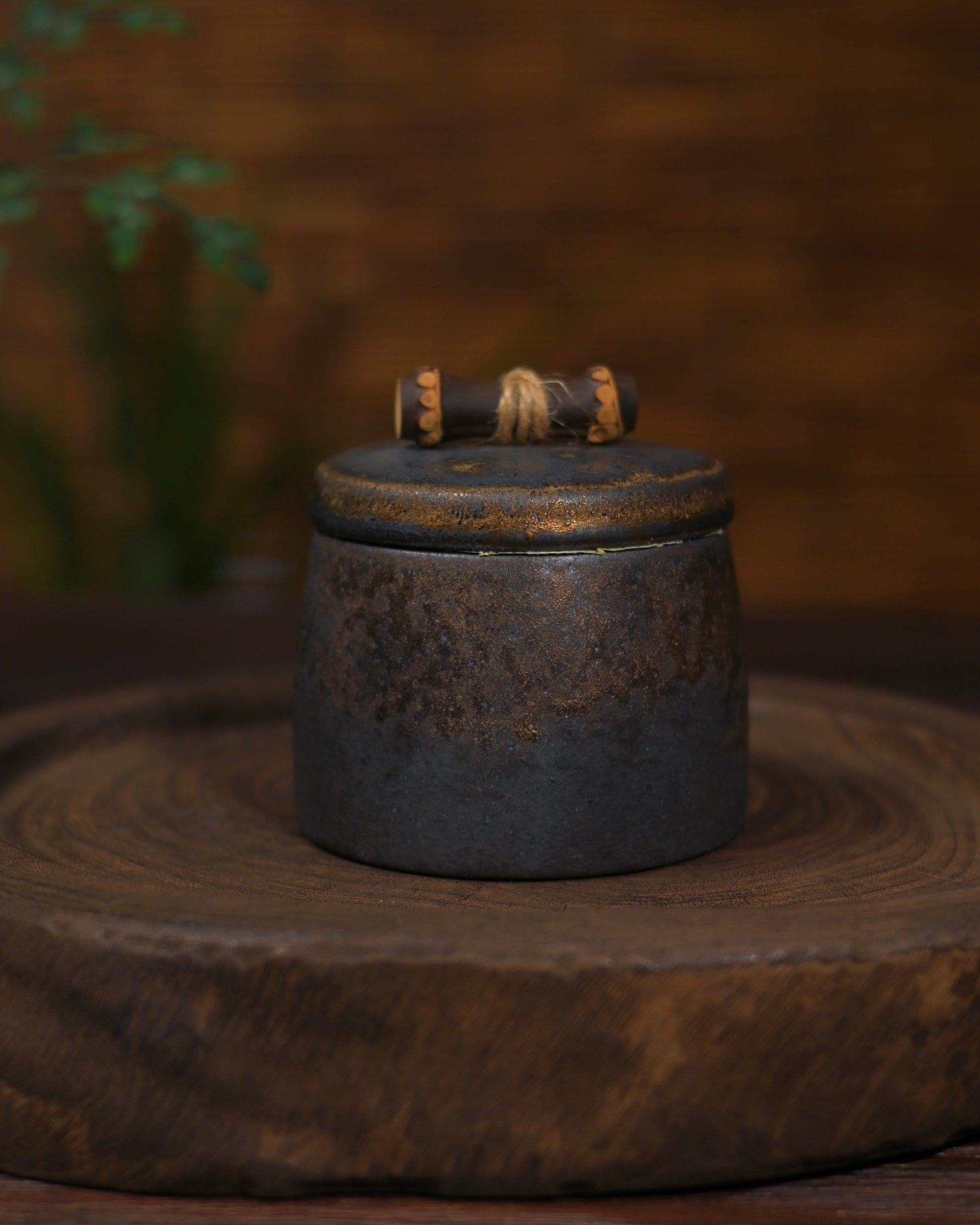 Exquisite small Chinese tea caddy with gold accents and traditional patterns.