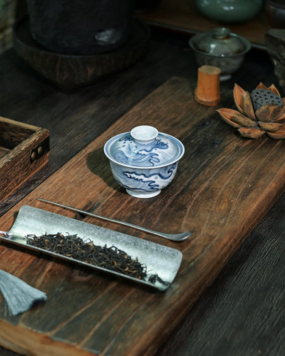 Cobalt blue wave motif symbolizing maritime spirit and natural power in Chinese art