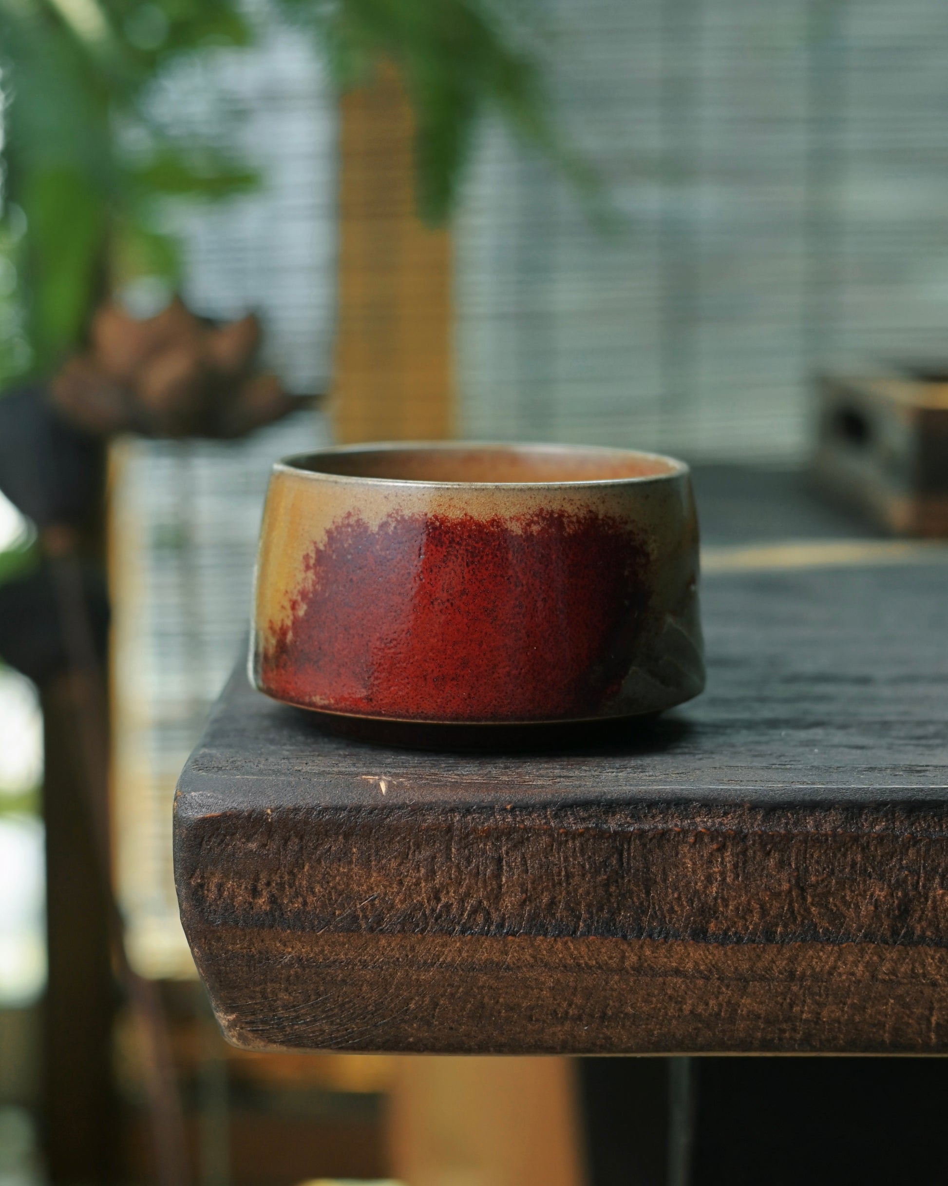 Copper and iron infused glaze chemistry producing unique color variations in high-temperature firing