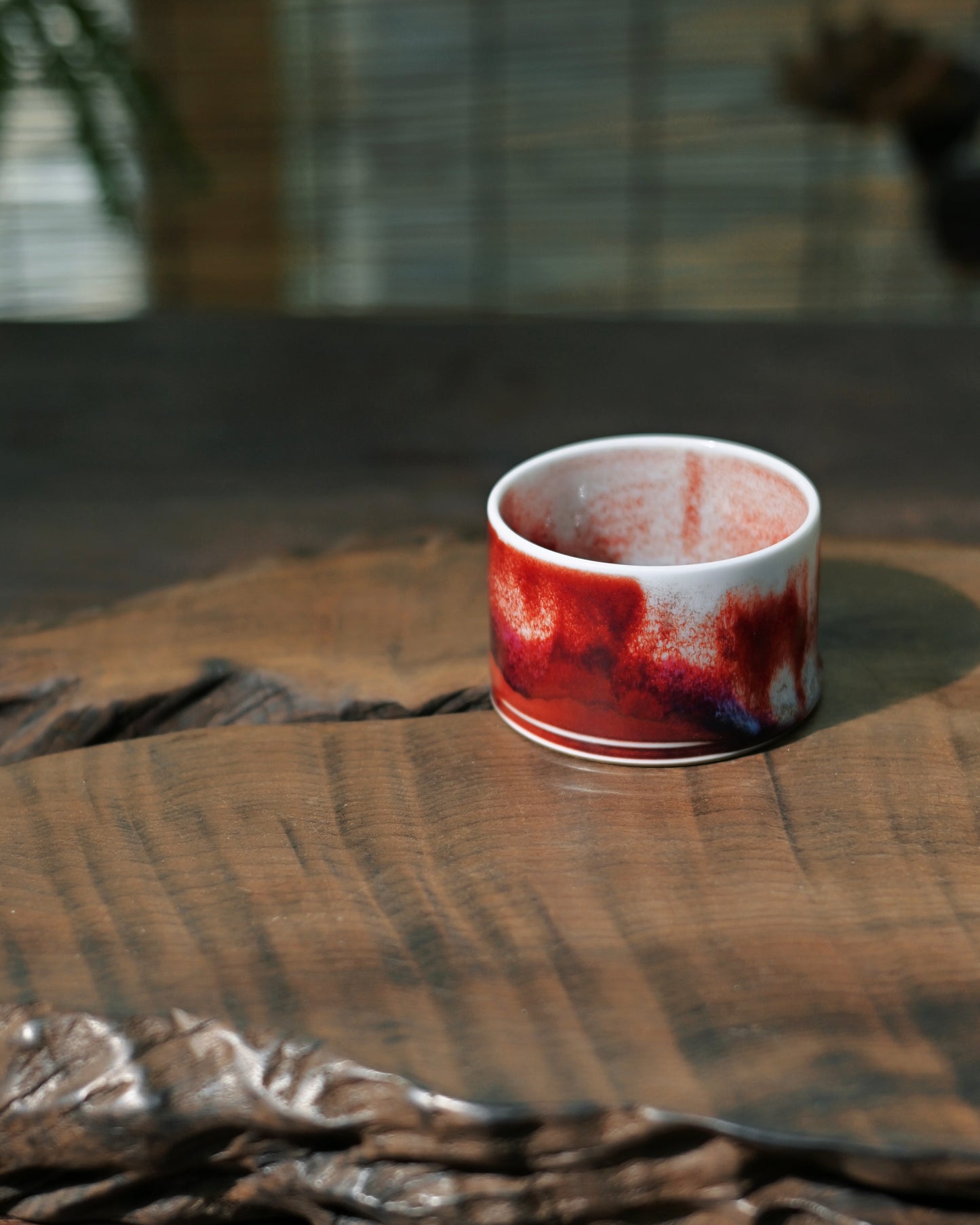 Copper and iron mineral glaze creating layered violet tones in Jun ware ceramic