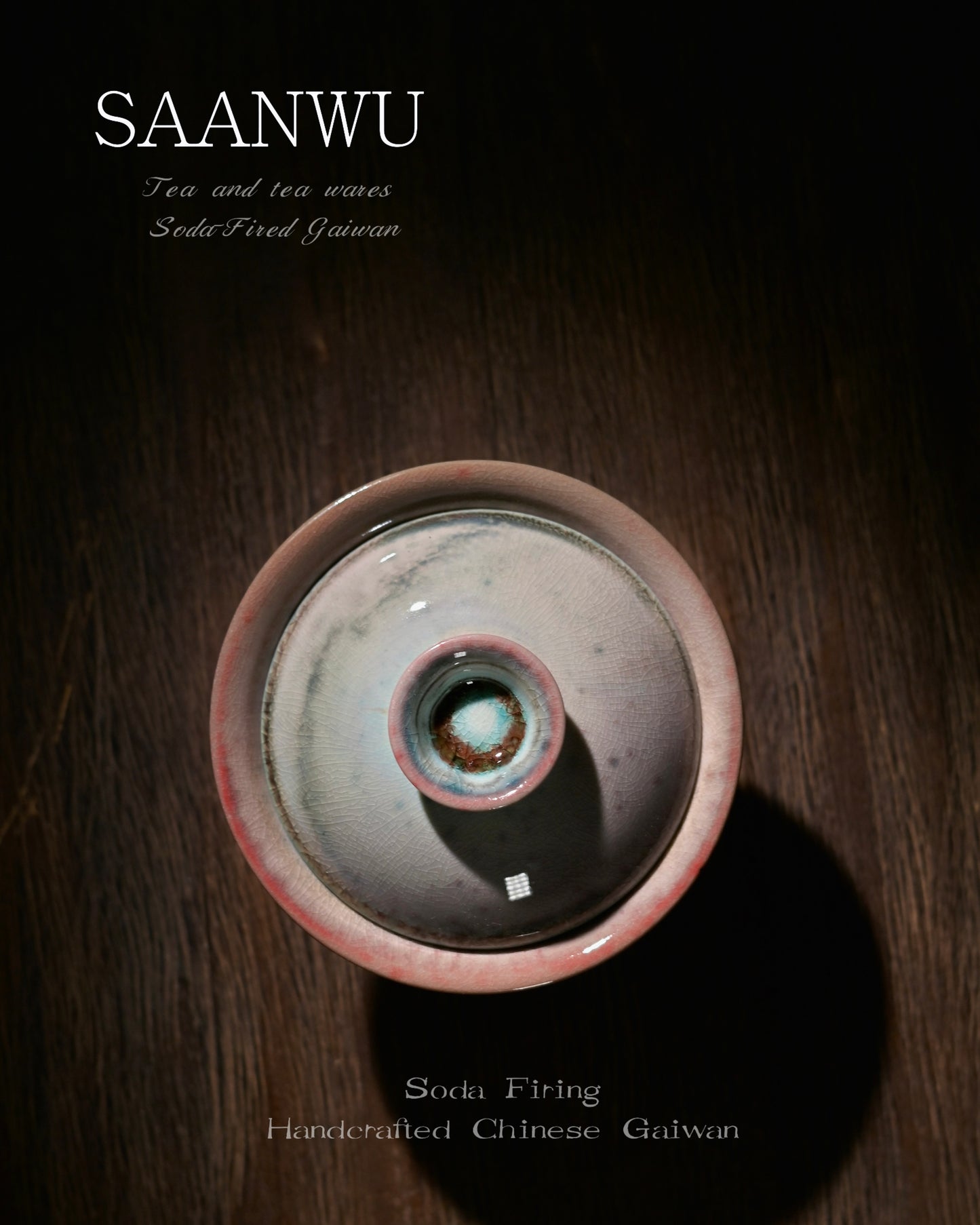 Macro detail of SAANWU soda-firing gaiwan knob, mottled cyan and rust crystal glaze, vintage crackle texture