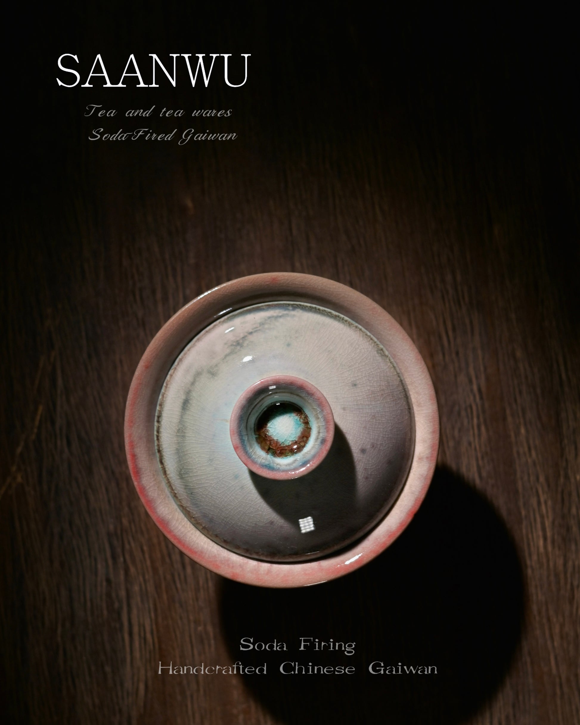 Macro detail of SAANWU soda-firing gaiwan knob, mottled cyan and rust crystal glaze, vintage crackle texture