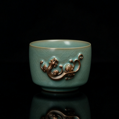 Ru Ware sky-blue glazed Chi dragon relief teacup 150ml resting on neutral fabric background