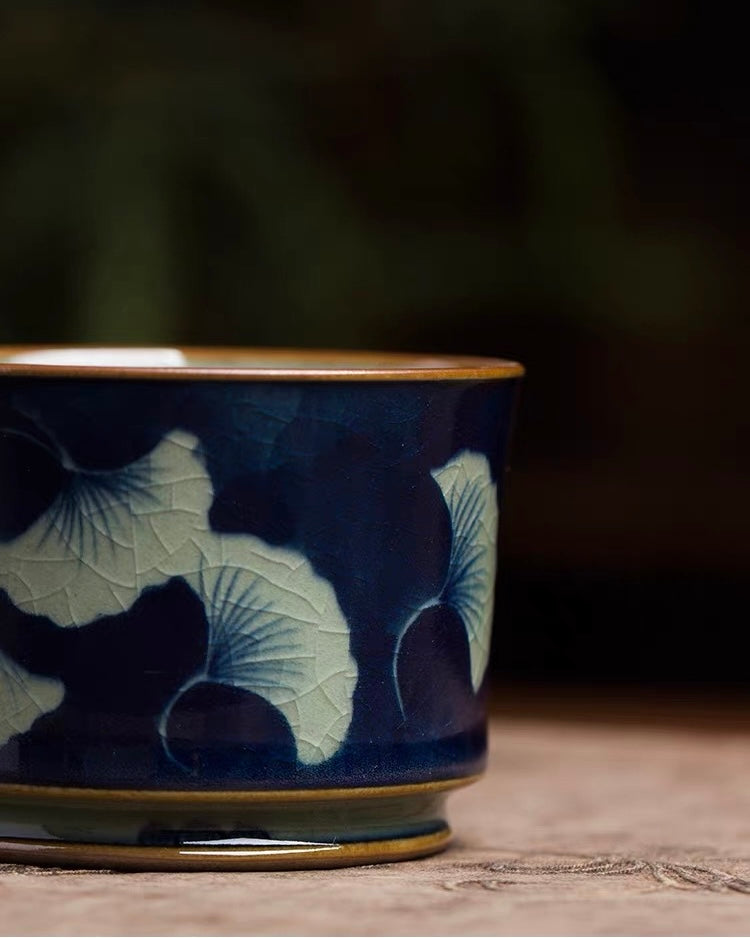 Rich deep‑blue underglaze‑blue teacup adorned with hand‑painted ginkgo leaves
