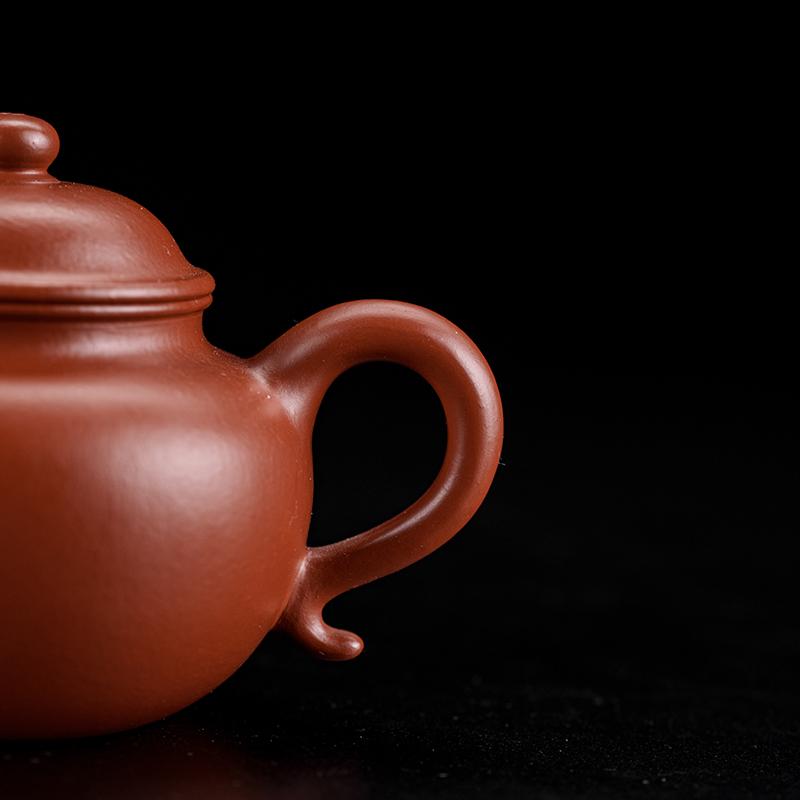 Original Dingshu Town Zisha pottery in warm rust-red vermilion clay with natural grain texture