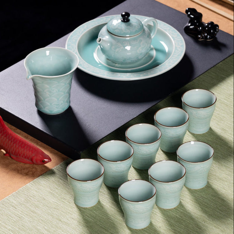 Full composition of 12-piece executive dragon celadon tea set featuring pitcher, cups, and artisan tea pet
