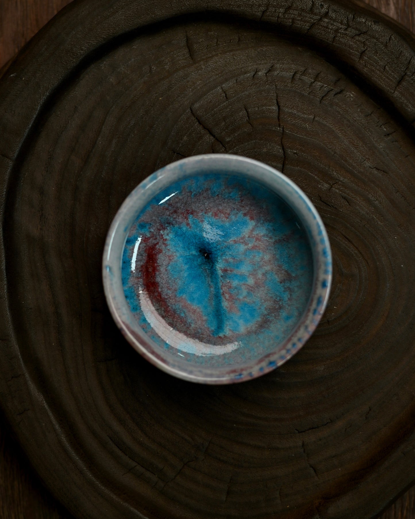 Fine crackle lines on the glaze surface, adding texture and depth to the lidded bowl's finish