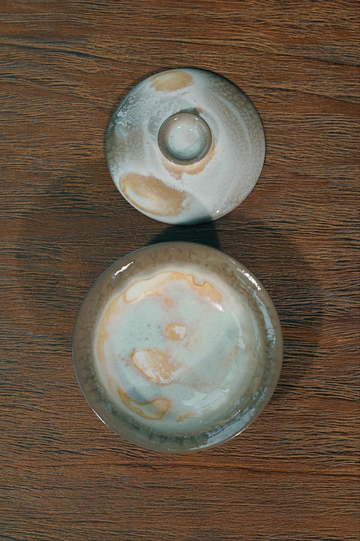 Handcrafted 100ml wood-fired tea bowl featuring elevated pedestal foot and wide-flared heat-safe rim