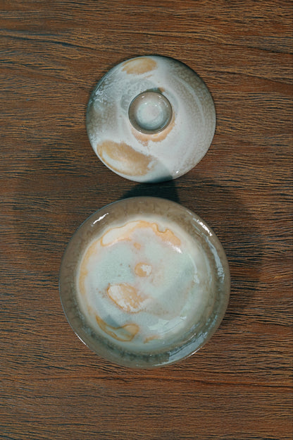 Handcrafted 100ml wood-fired tea bowl featuring elevated pedestal foot and wide-flared heat-safe rim