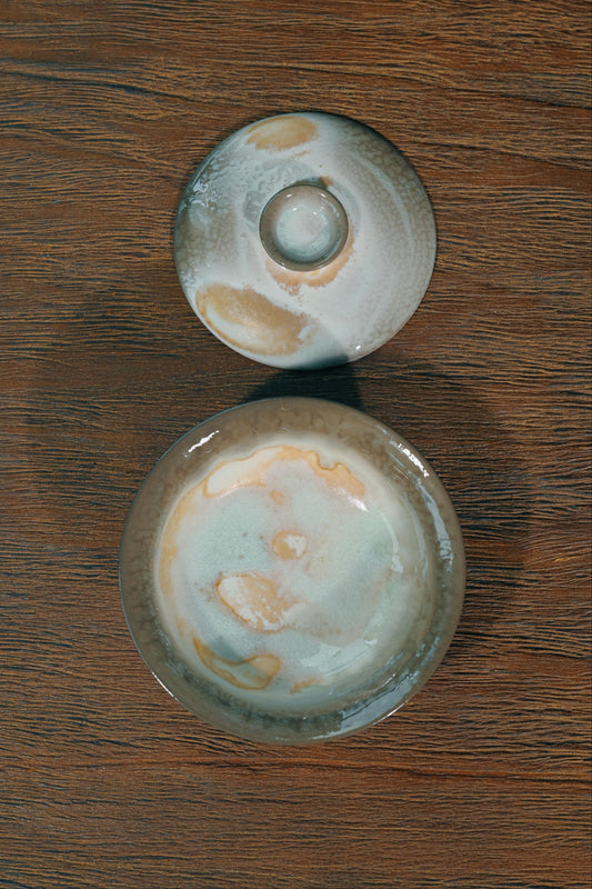 Handcrafted 100ml wood-fired tea bowl featuring elevated pedestal foot and wide-flared heat-safe rim