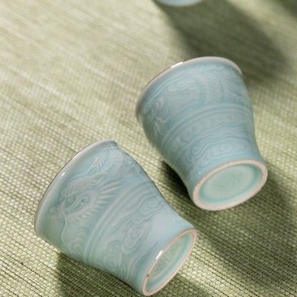 Artisanal flagship Longquan Celadon dragon tea set packed in luxury brocade trunk for high-end presentation