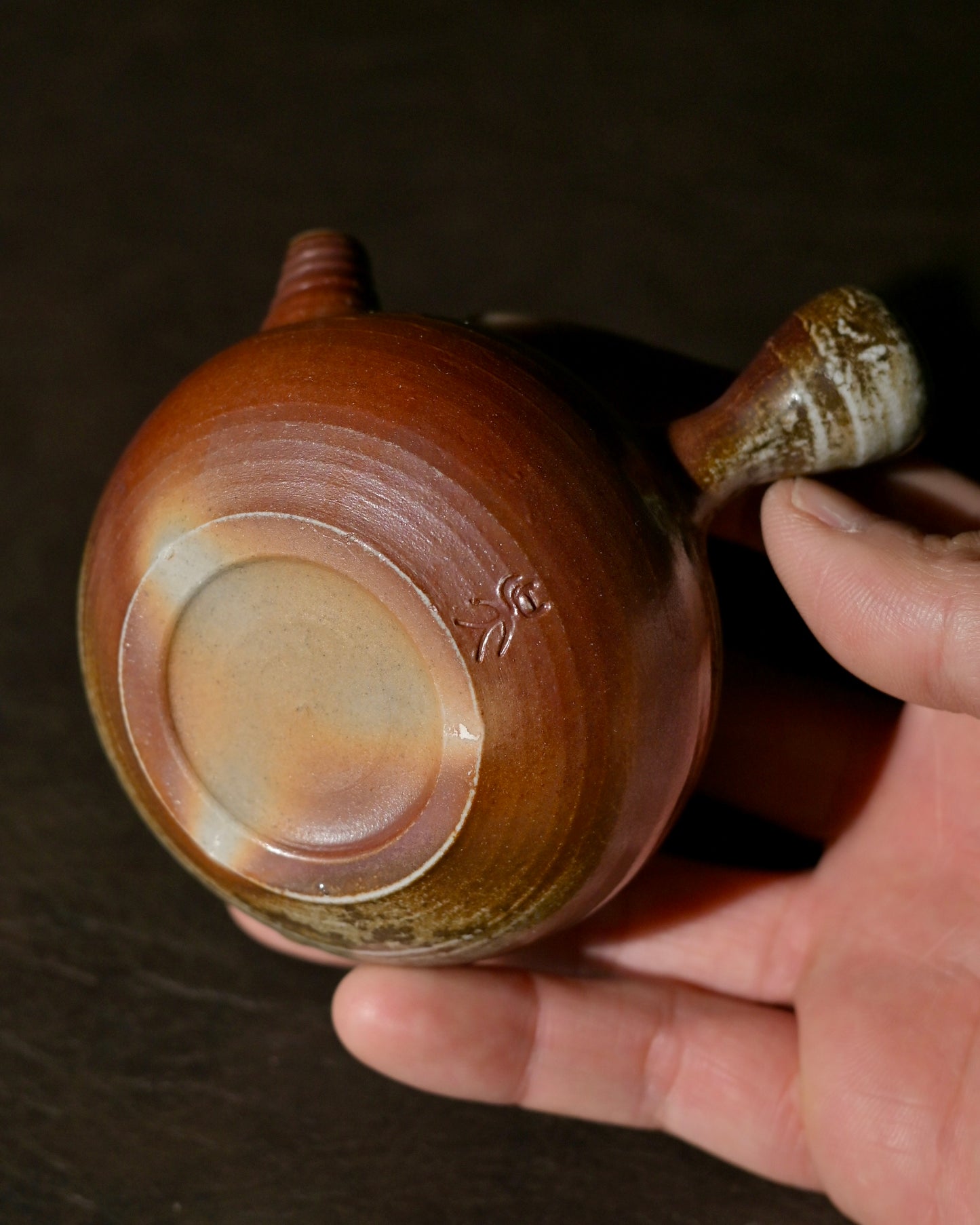 Flame trace ceramic surface preserving visible paths of fire movement during kiln firing