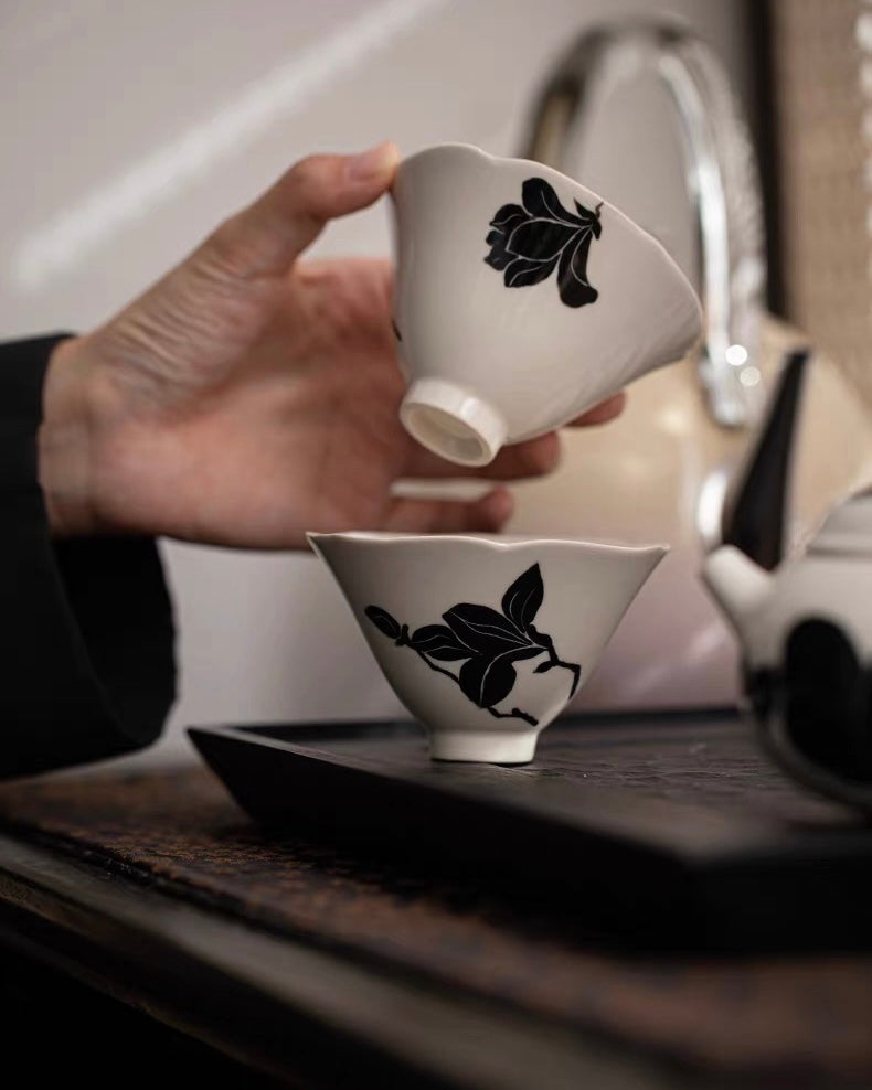 80ml tea bowl with blooming edge design, showcasing ink-style magnolia against misty ash glaze background