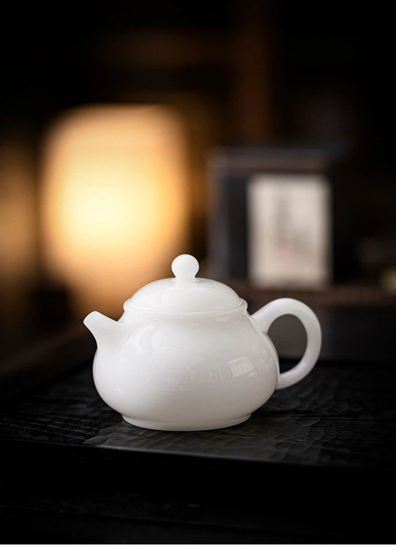 Delicate icy-white porcelain teapot with rounded Xishi silhouette