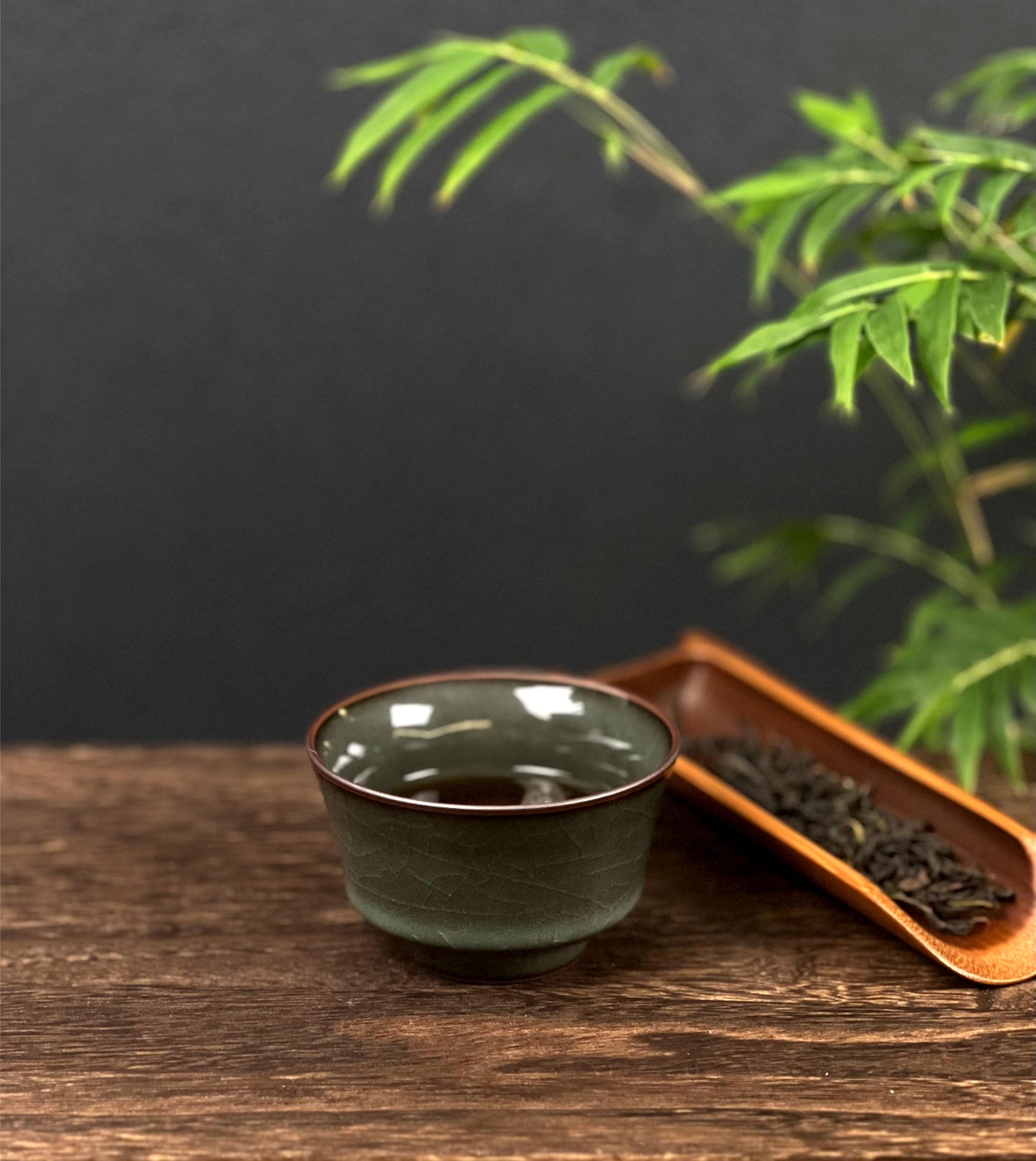 Traditional crackle-glazed ware in iron-bodied Longquan celadon, designed for tea ceremony use.