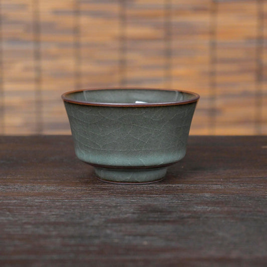 Longquan Celadon Ge Kiln horse-shoe shape teacup in dark green glaze