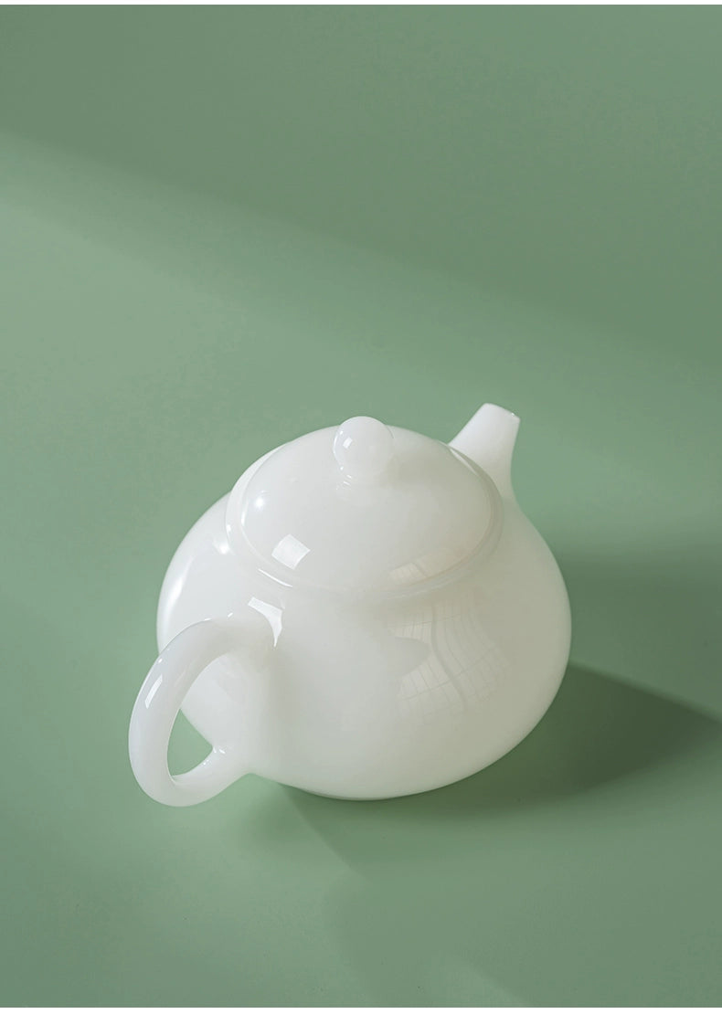 Elegant white jade-like porcelain teapot in Xishi shape