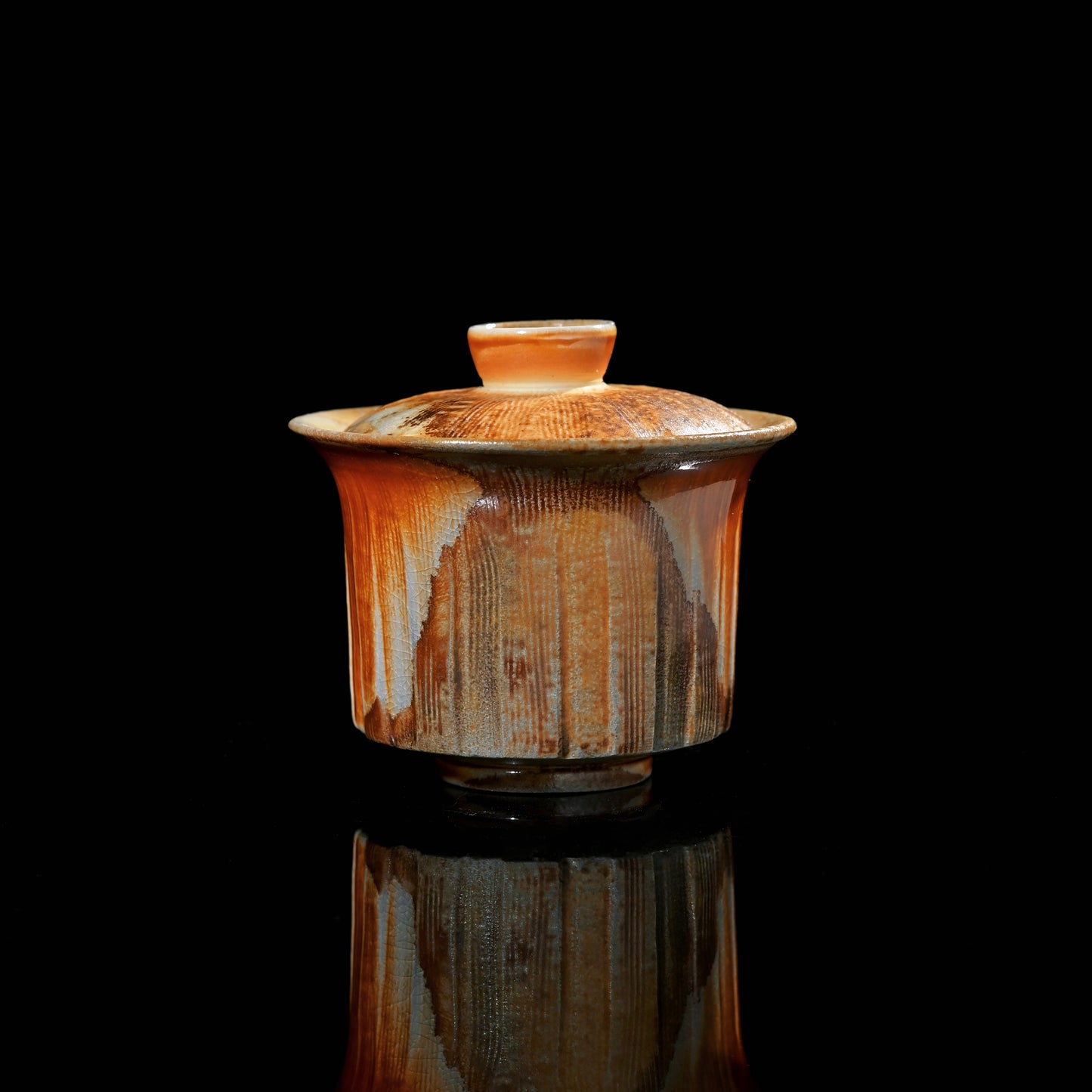 Japanese wood-fired hand-carved chawan with uneven glaze pattern