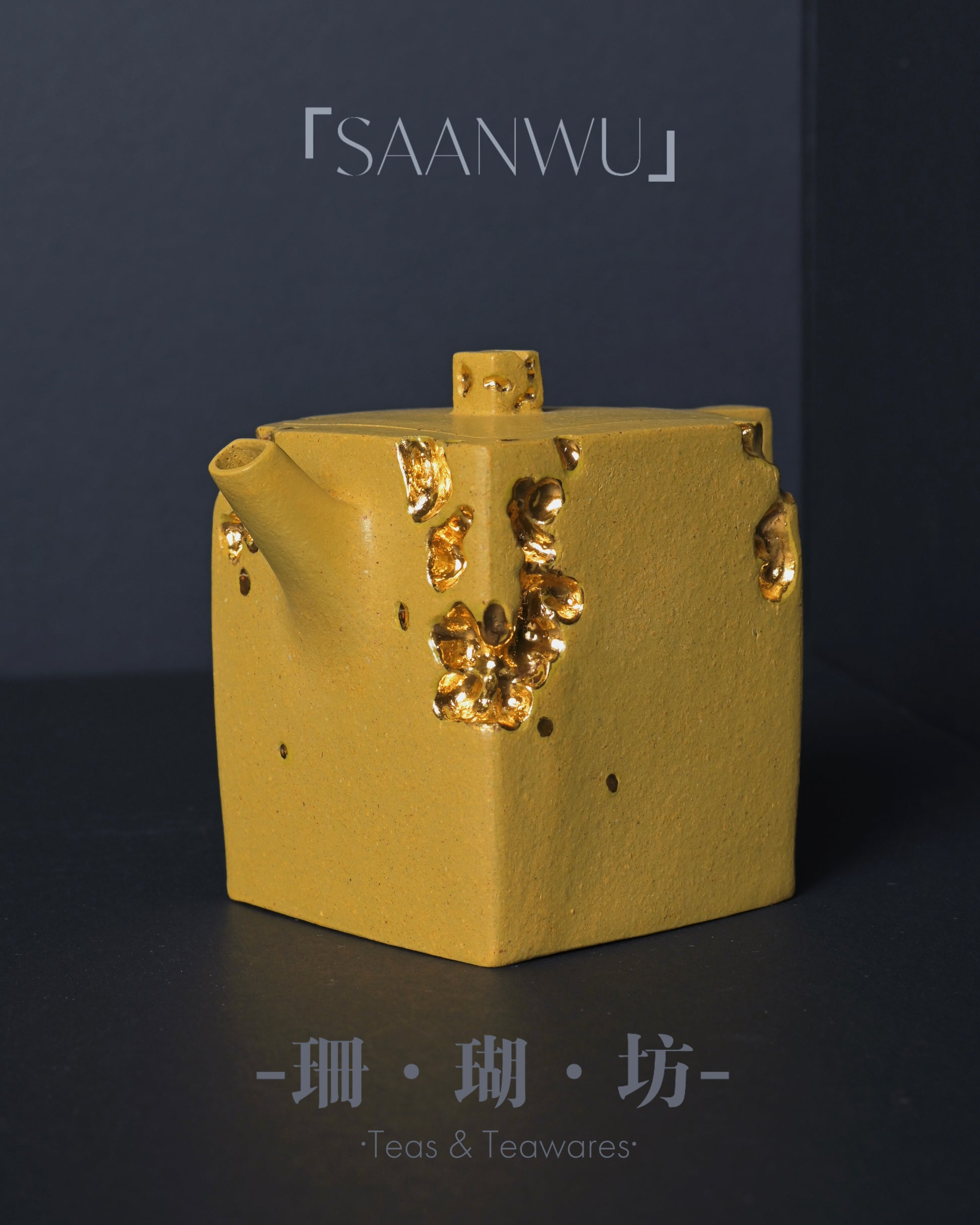 Gold foil inlay technique applied to Zisha teapot surface for luxurious decorative effect