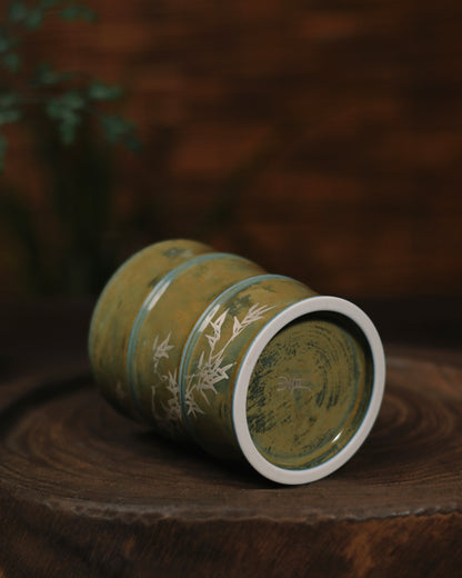 The 'Bamboo Rhythm' mug in a cozy tea-time setting, paired with loose-leaf tea and natural wooden accessories