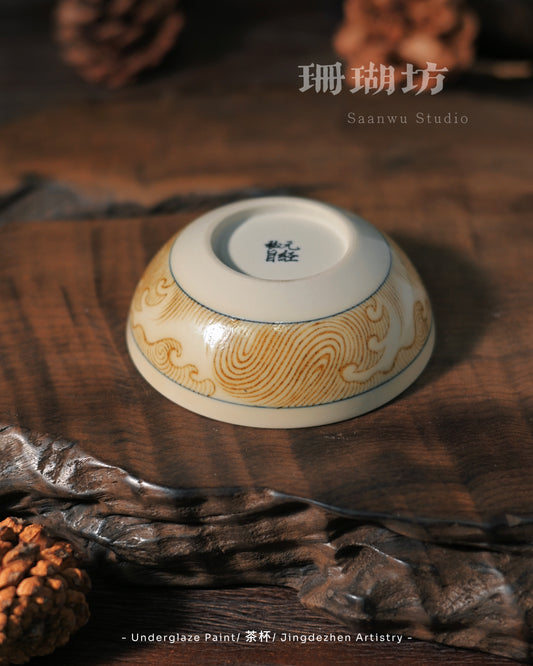 Golden cobalt mythological creature requiring precise high-temperature firing for warm metallic tones